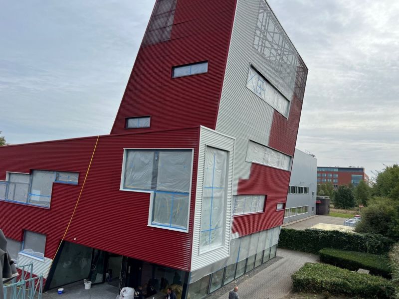 Overspuiten gevel en dak bekleding